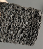 Salt-in-matrix material. A black, sponge-like substance.